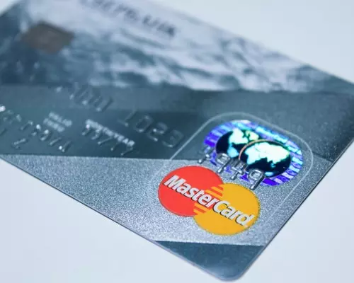 how long after paying off credit cards does credit score improve